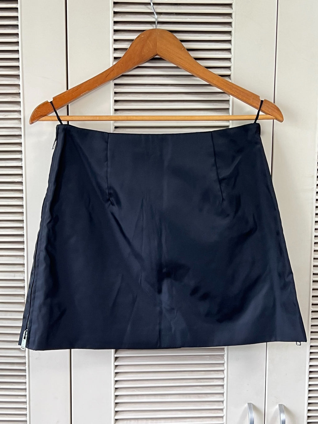 Prada black triangular logo studded skirt