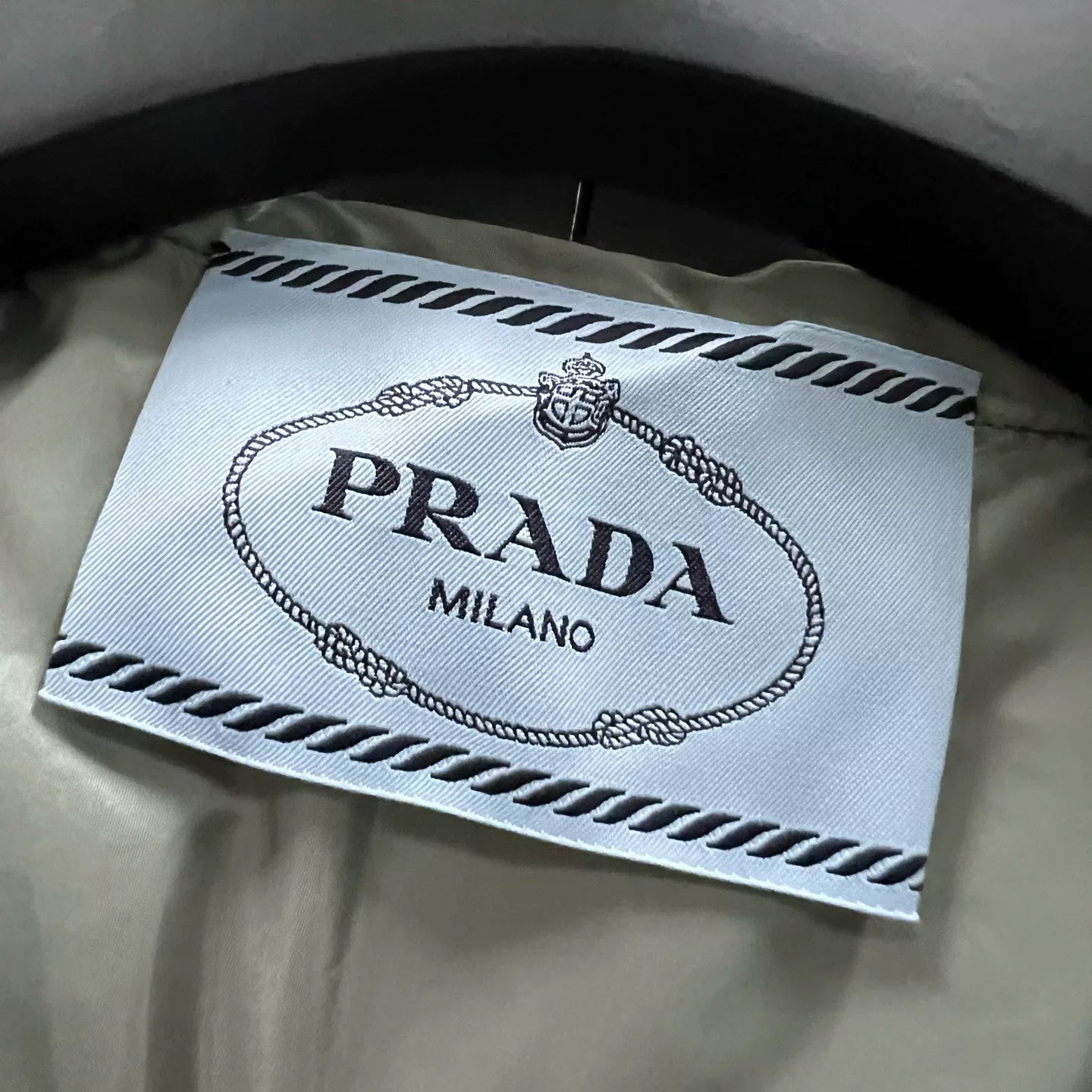 Prada Silver Hooded Triangle Logo Cape