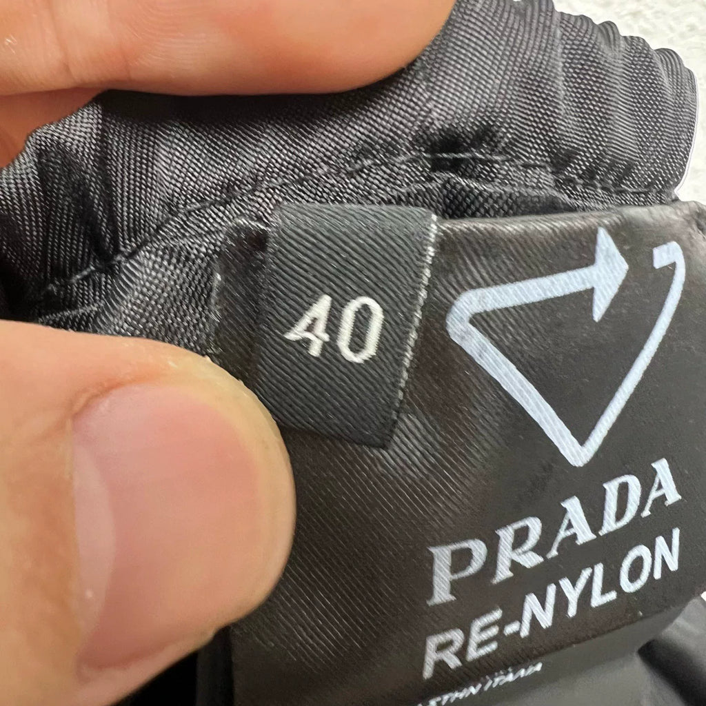 PRADA metal triangle logo zip skirt