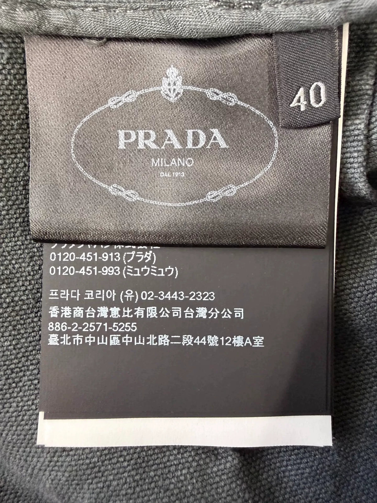 Prada Distressed Triangle Logo Denim Skirt
