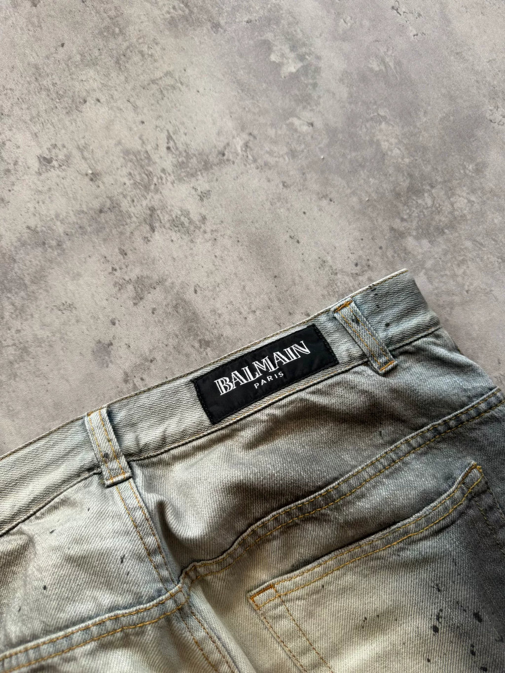 Balmain Paris 11SS Ice Blue Wash Ghost‑claw Oil‑stain Splatter Curved Denim Pants by Christophe Decarnin