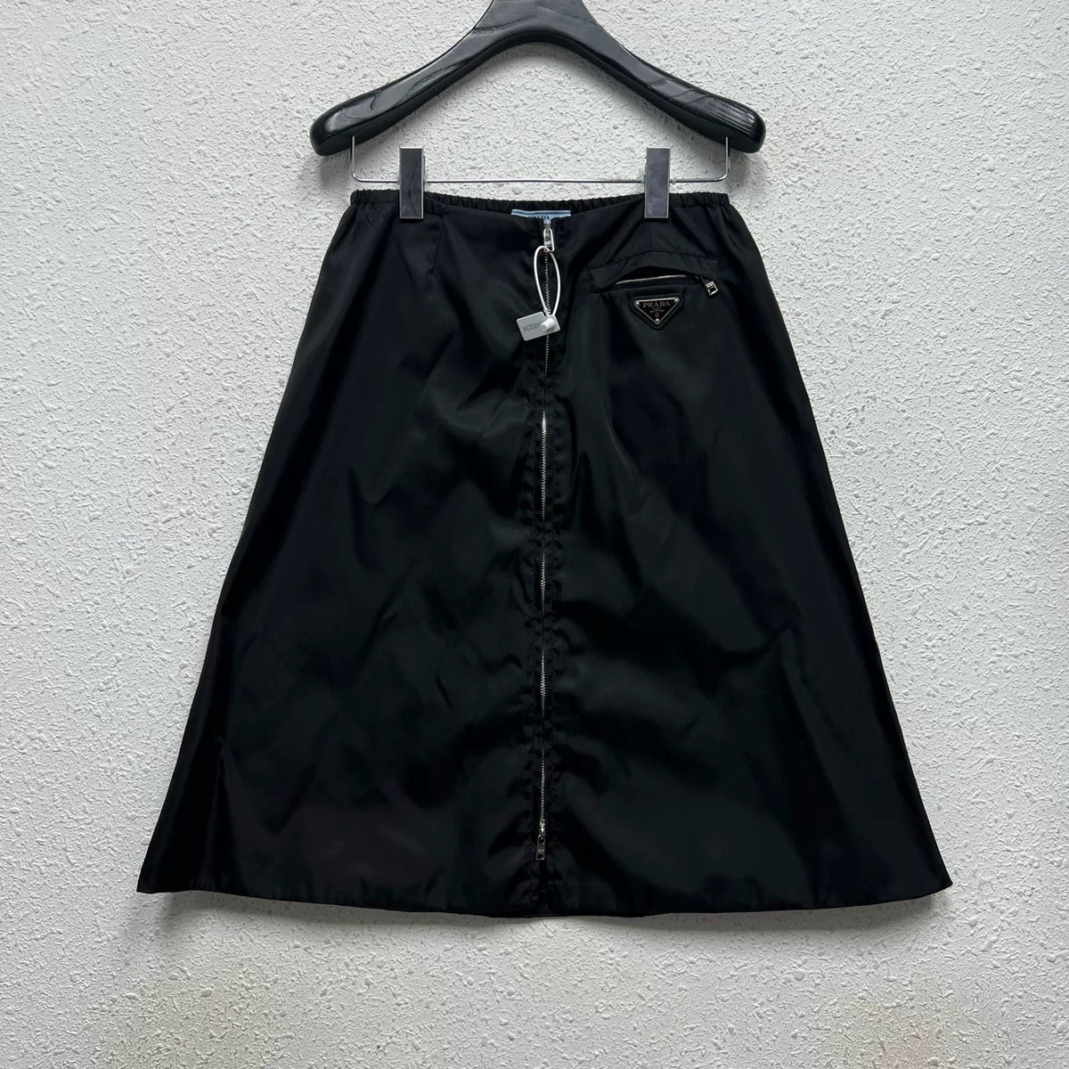 PRADA metal triangle logo zip skirt