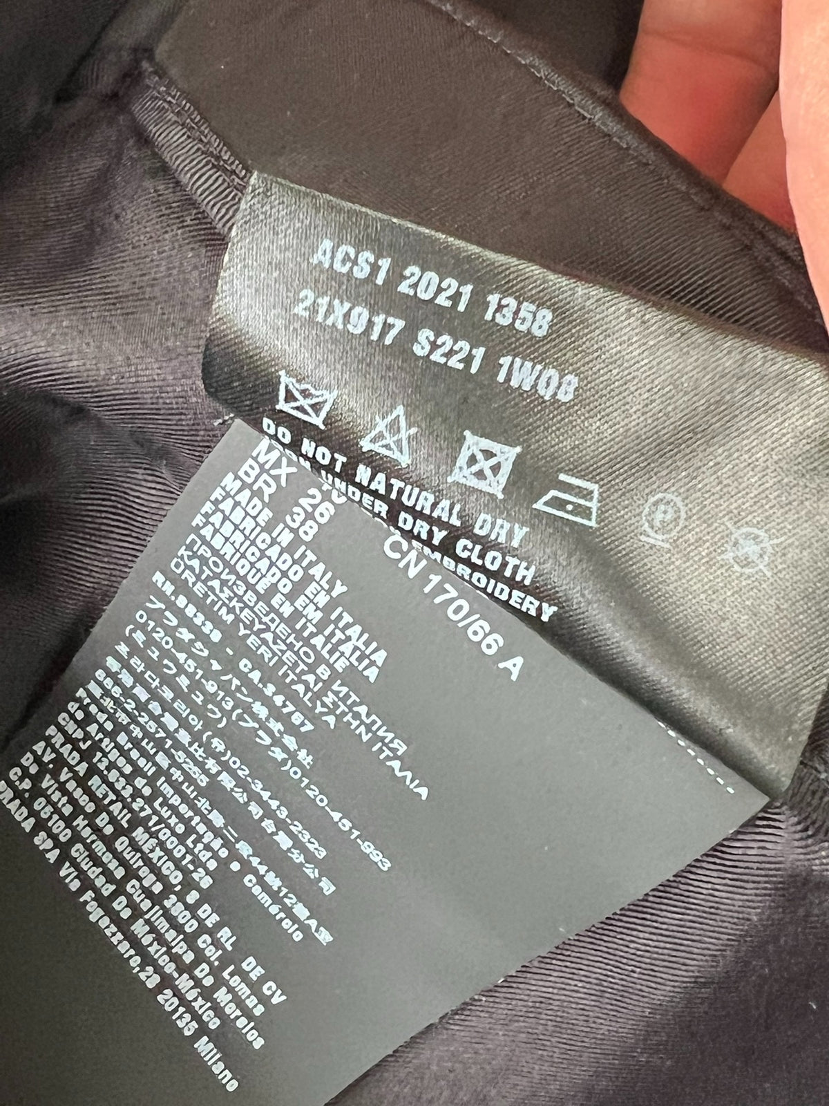 Prada black triangular logo studded skirt
