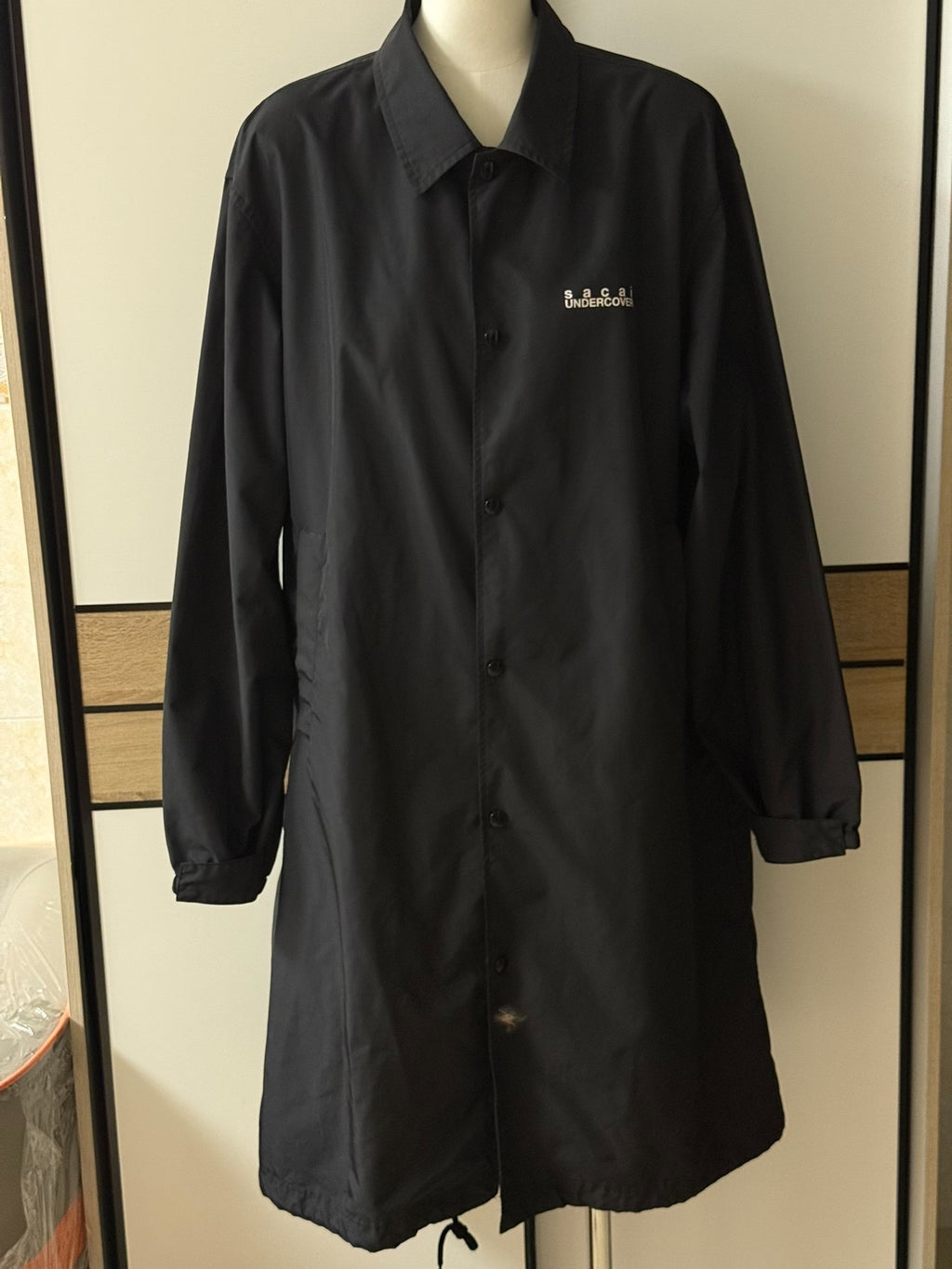 Sacai and Undercover collaboration runway coat