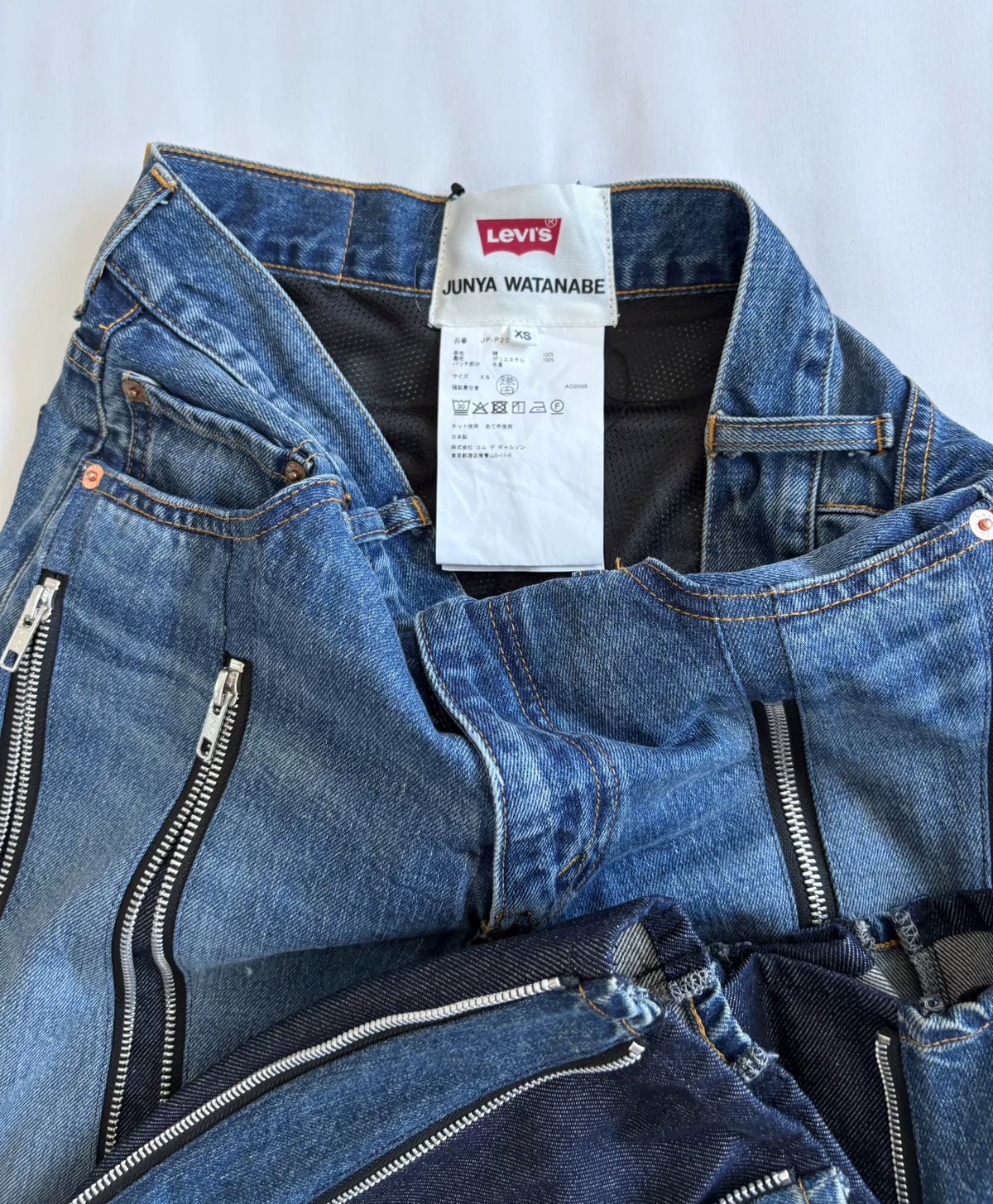 JUNYA WATANABE premium deconstructed irregular‑shape zipper denim pants