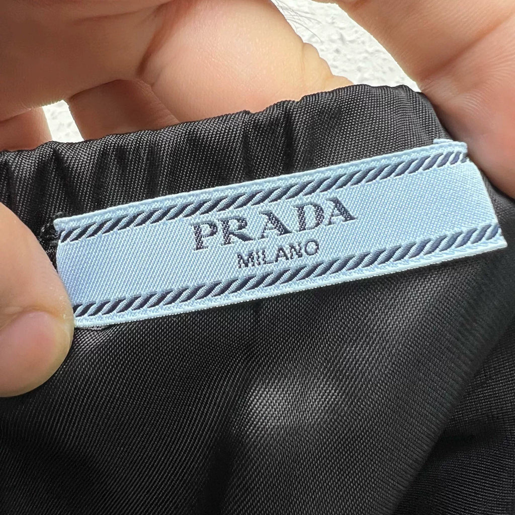PRADA metal triangle logo zip skirt