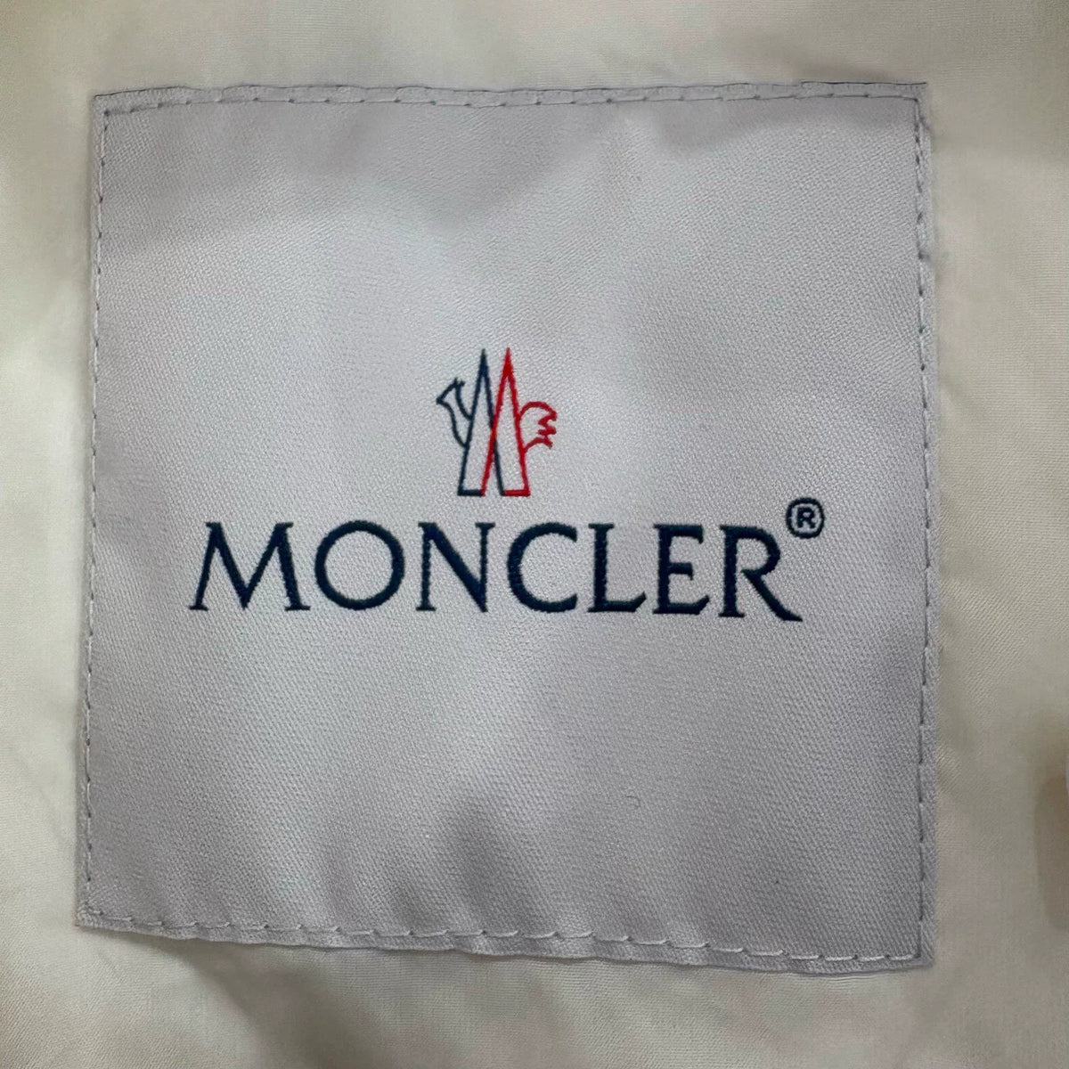 Moncler off-white quilted zip-up down jacket