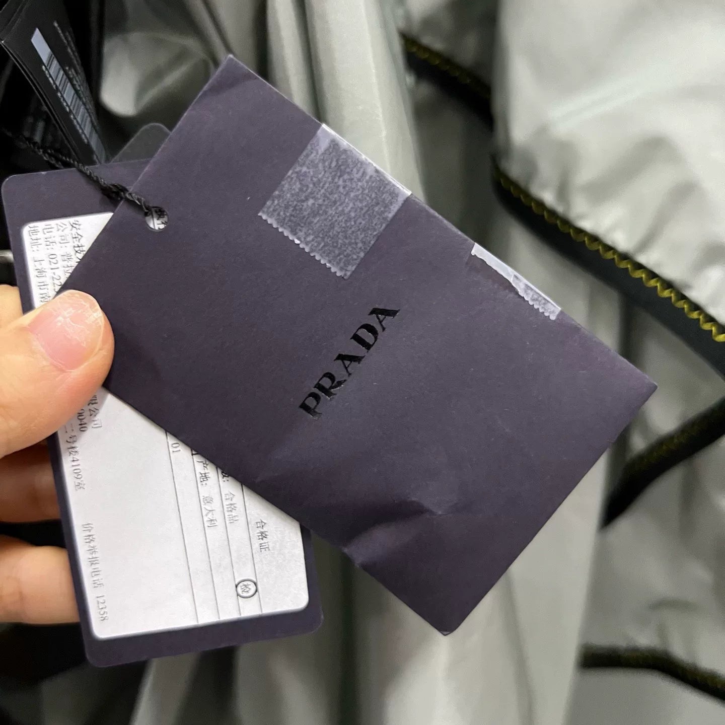 Prada Silver Hooded Triangle Logo Cape