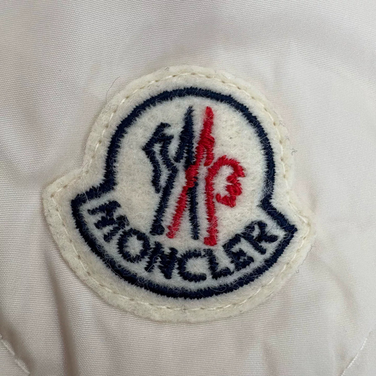 Moncler off-white quilted zip-up down jacket