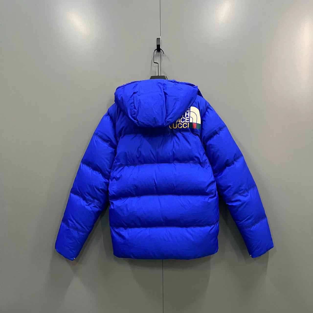 GUCCI x TNF collaboration blue logo down jacket