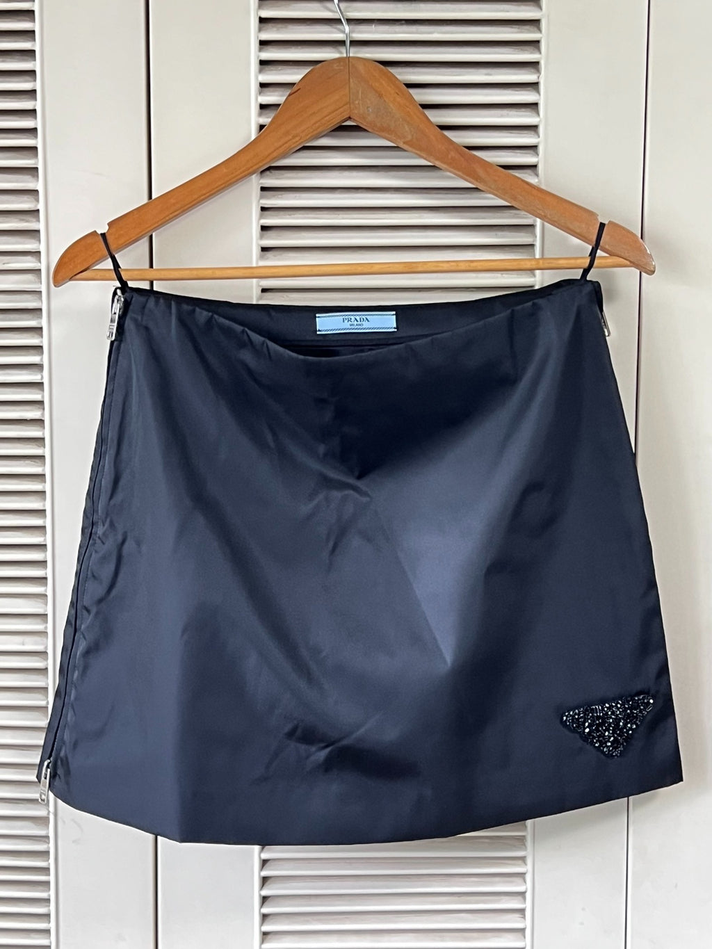 Prada black triangular logo studded skirt