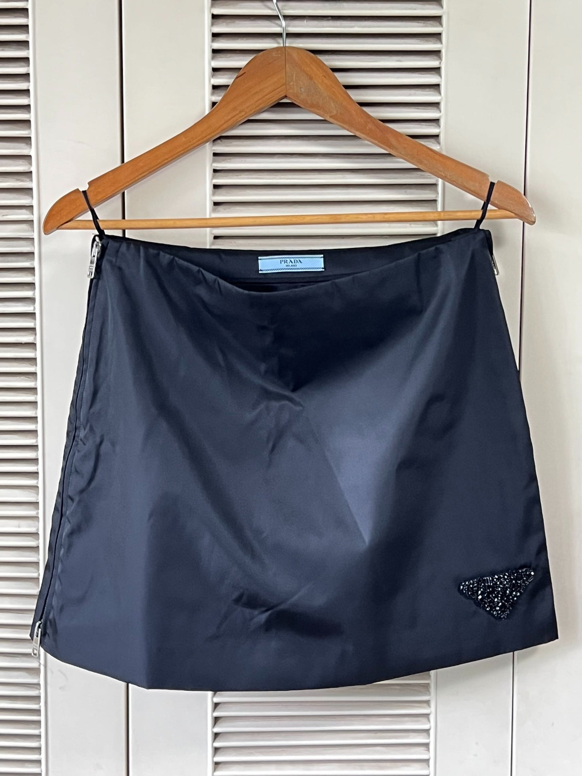 Prada black triangular logo studded skirt