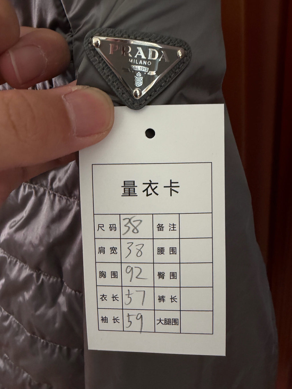 Prada Metal Triangle Logo Down Jacket