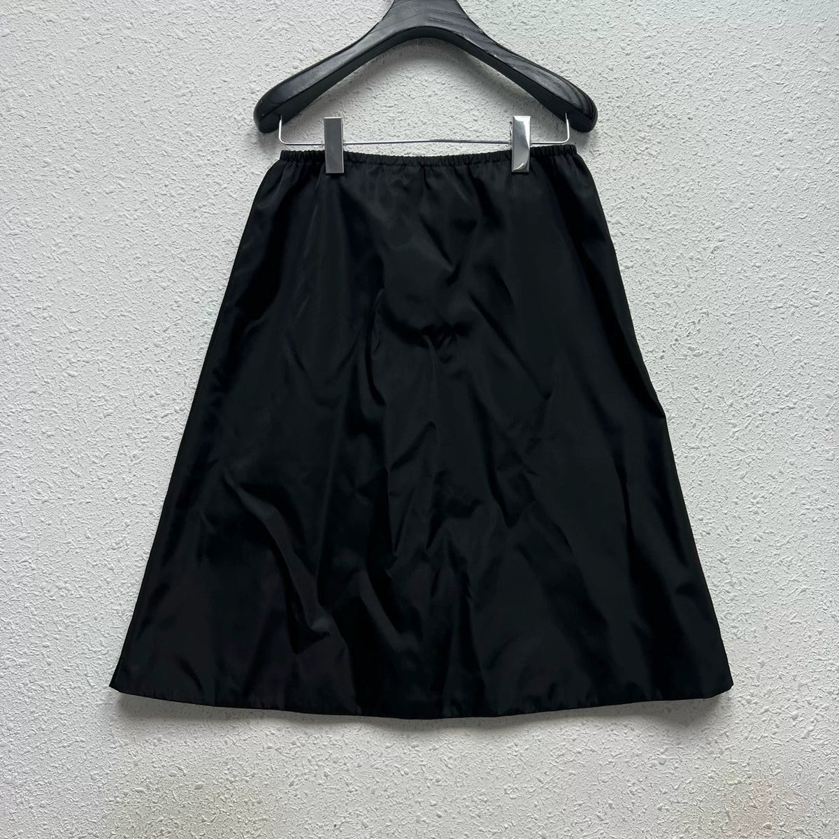 PRADA metal triangle logo zip skirt