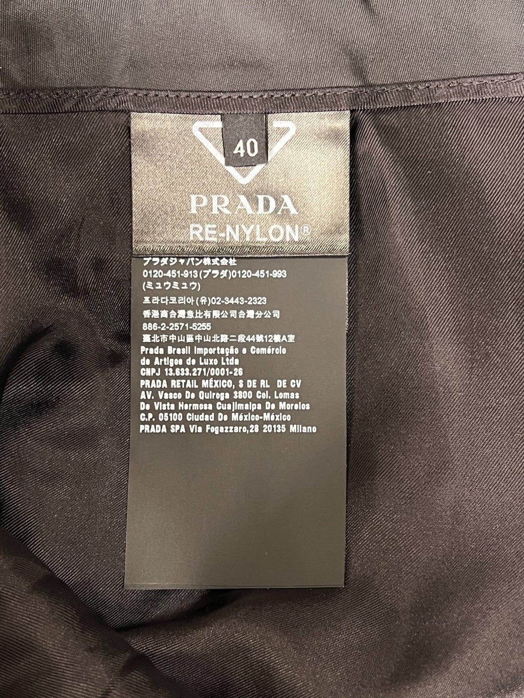 Prada black triangular logo studded skirt