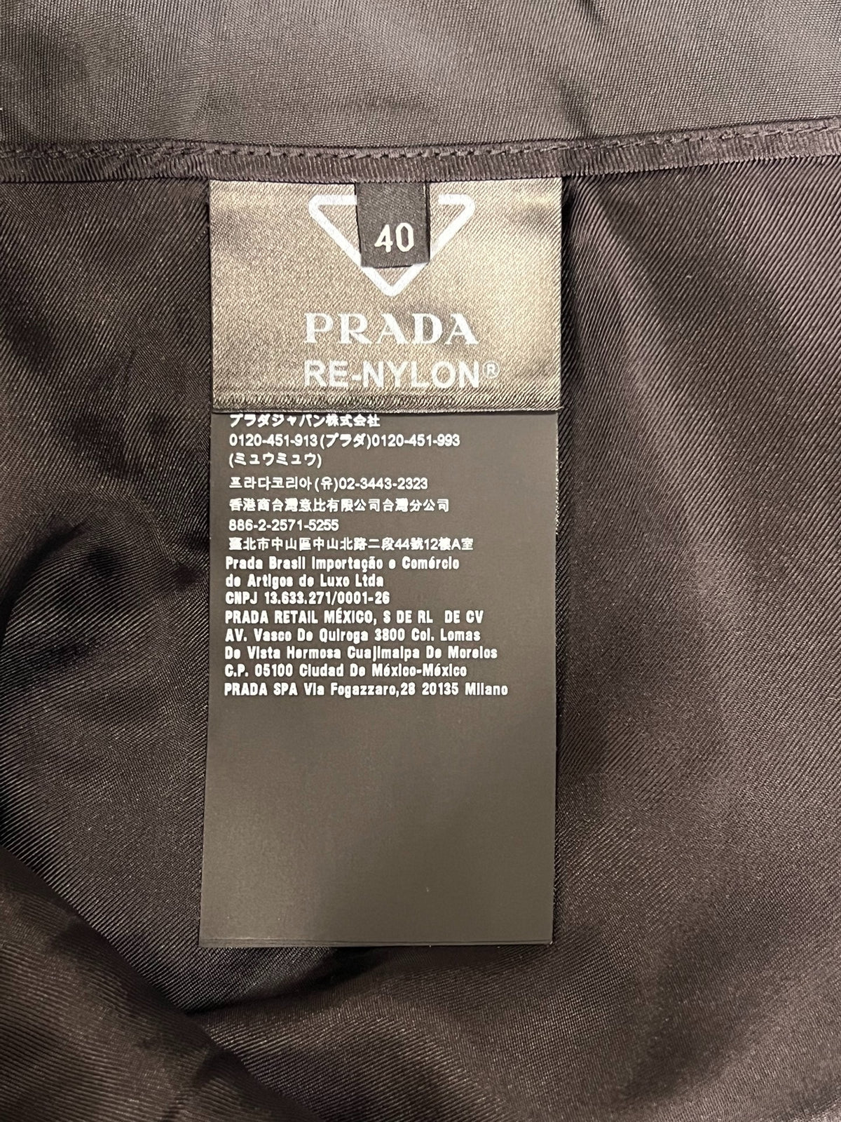 Prada black triangular logo studded skirt