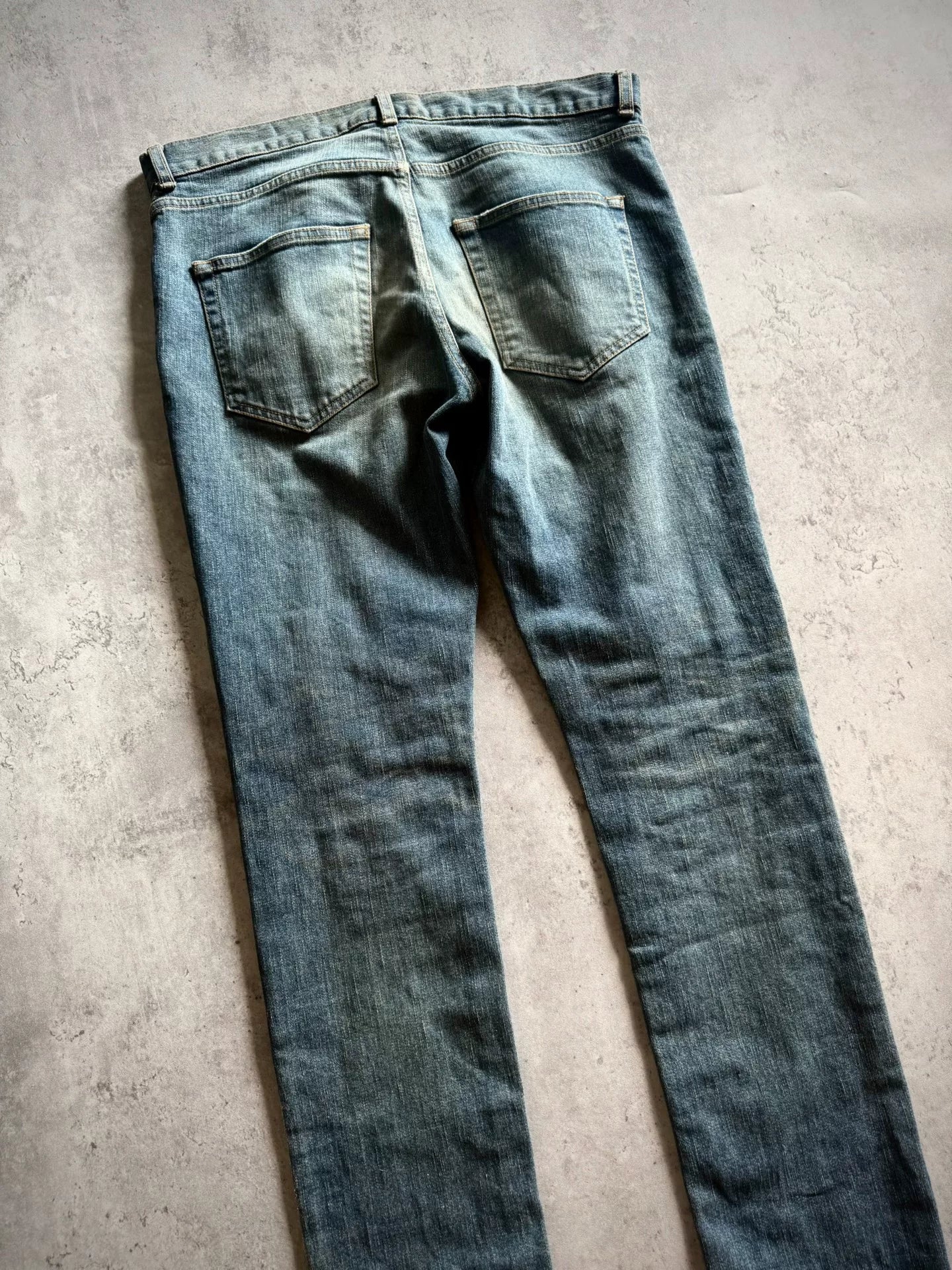 Saint Laurent 17AW Blue Washed Mud-Dyed Single-Knee Knife-Cut Jeans by Anthony Vaccarello