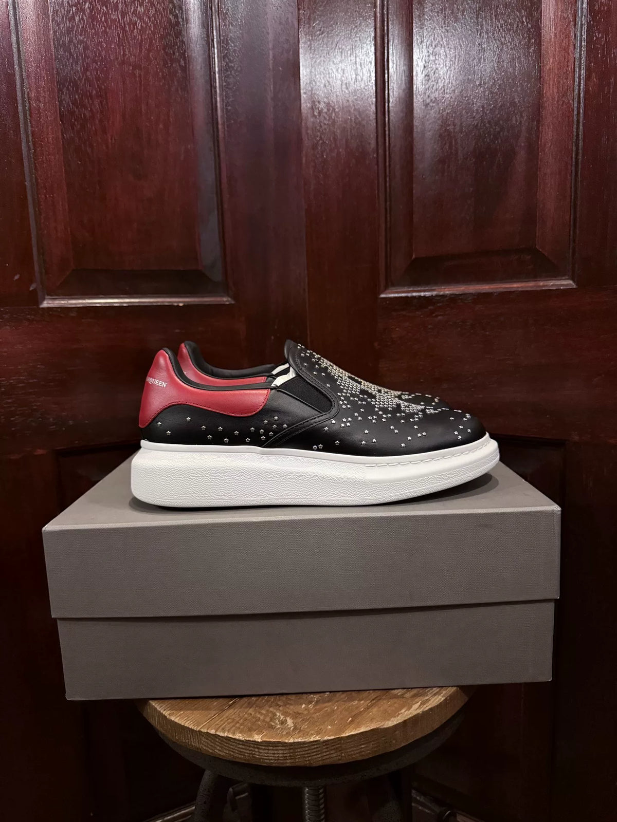 Alexander McQueen Black Five-Pointed Star Studded Skull Red Heel Chunky Sole Slip-On Sneakers