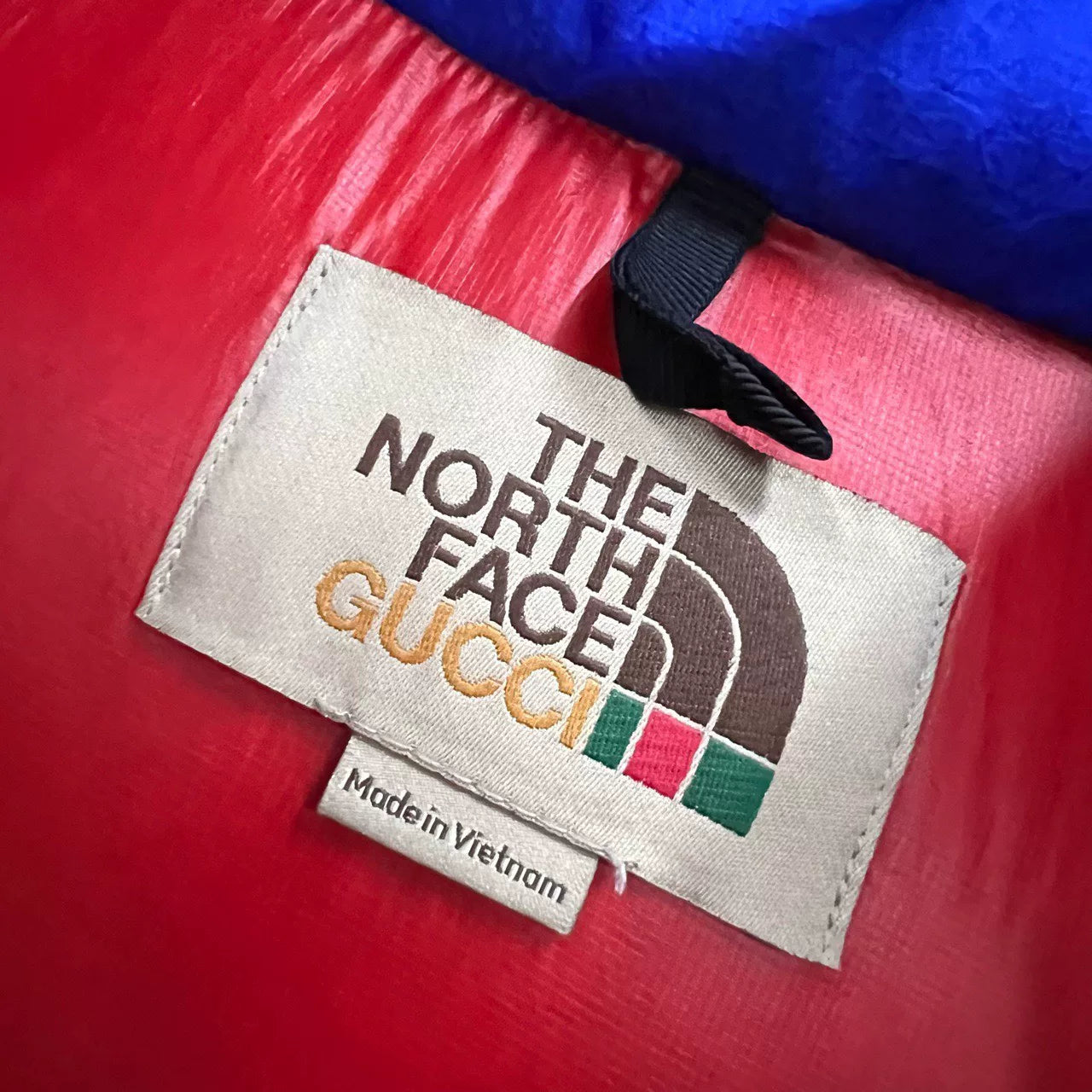 GUCCI x TNF collaboration blue logo down jacket