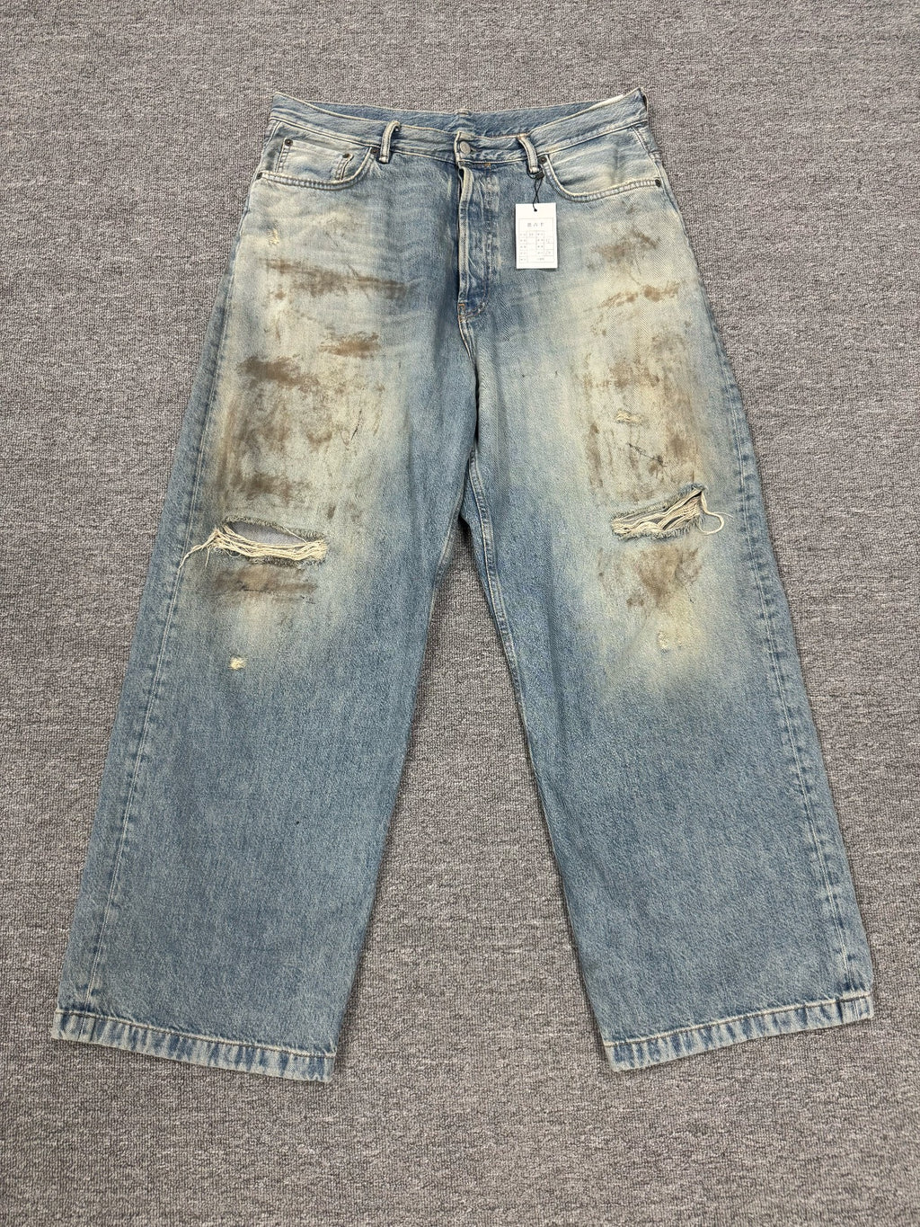 Acne Studios Mud-Dyed Ripped Denim Trousers