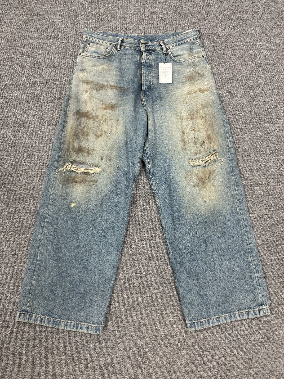 Acne Studios Mud-Dyed Ripped Denim Trousers
