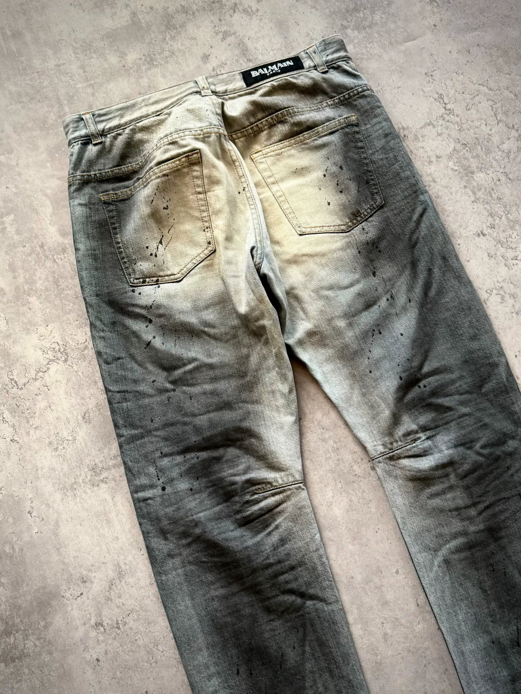 Balmain Paris 11SS Ice Blue Wash Ghost‑claw Oil‑stain Splatter Curved Denim Pants by Christophe Decarnin