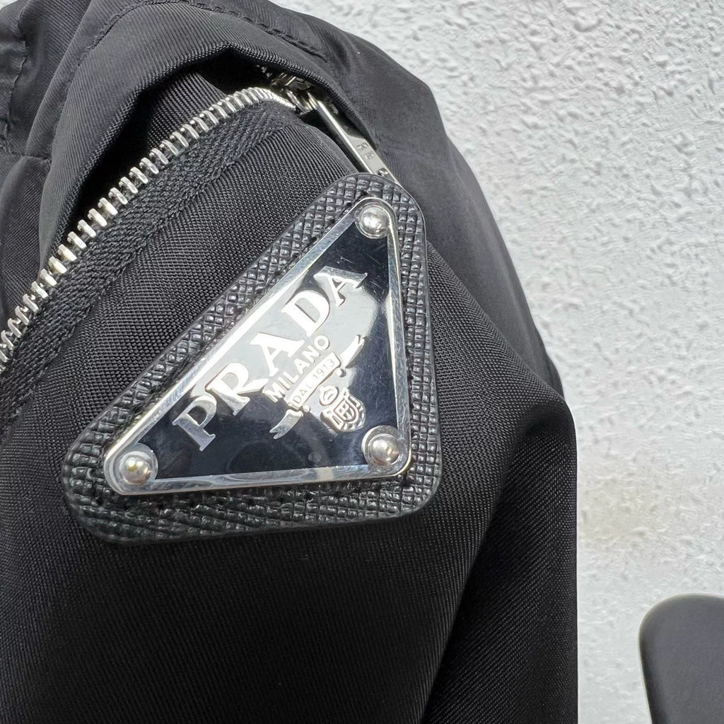 PRADA metal triangle logo zip skirt