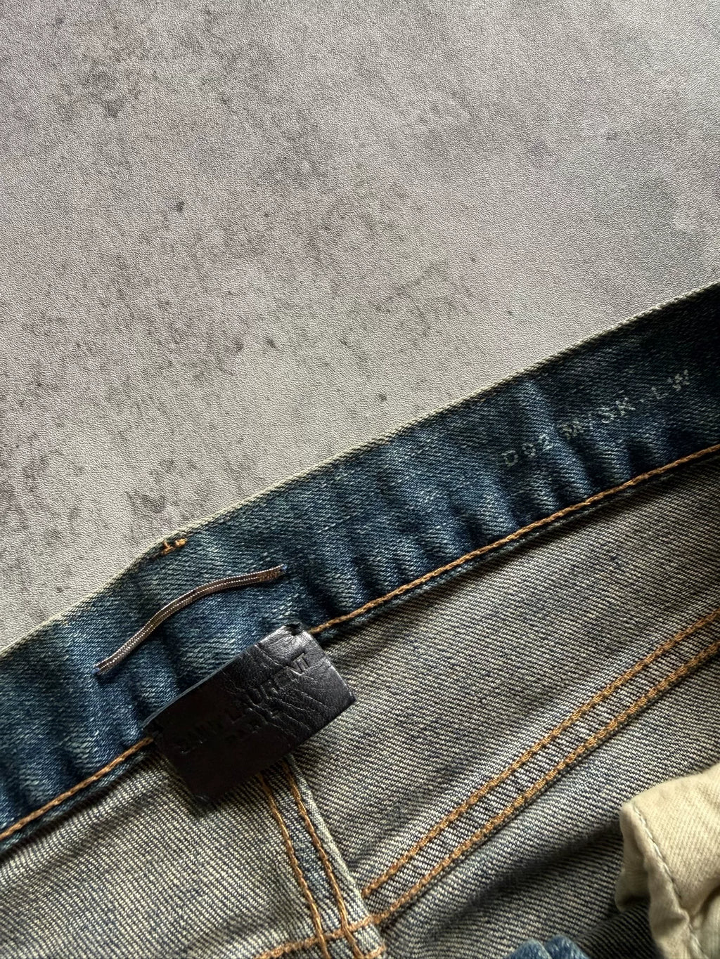 Saint Laurent 17AW Blue Washed Mud-Dyed Single-Knee Knife-Cut Jeans by Anthony Vaccarello