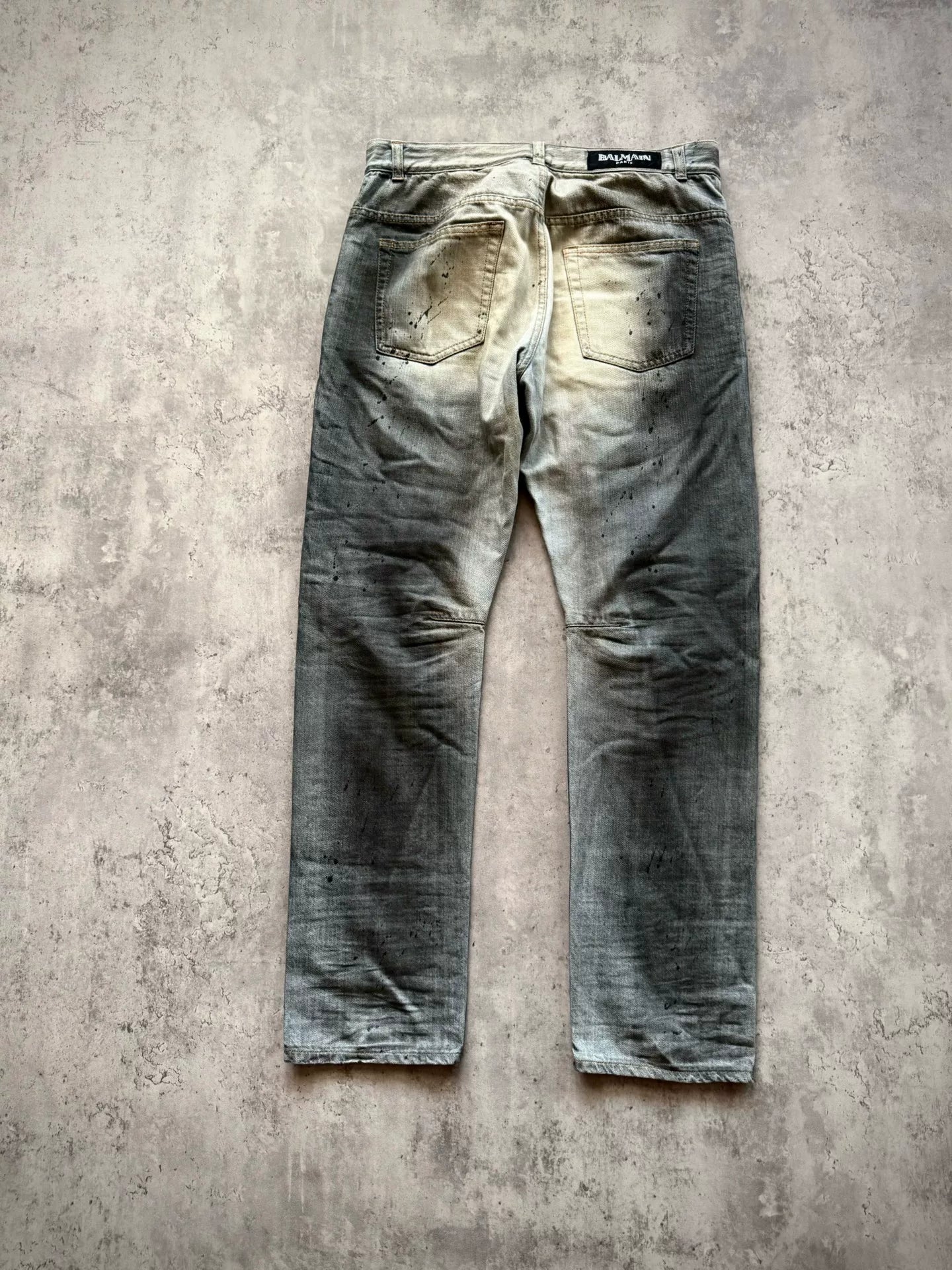 Balmain Paris 11SS Ice Blue Wash Ghost‑claw Oil‑stain Splatter Curved Denim Pants by Christophe Decarnin